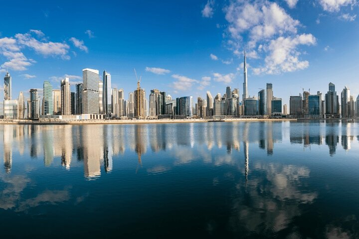 Experience the stunning skyline of Dubai reflected in serene waters blending modern architecture with captivating heritage perfect for creating unforgettable memories during your city exploration.